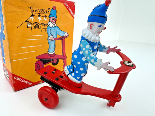 Vintage clockwork wind tin - up,